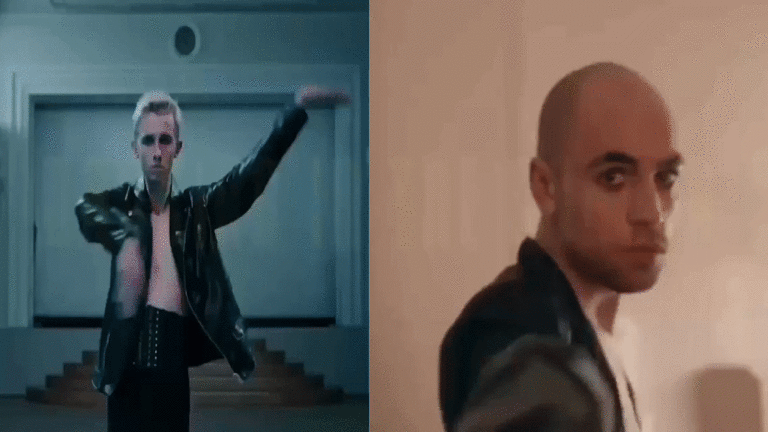 Two male dancers performing in a dance studio, one wearing a black leather jacket and the other with a shaved head.
