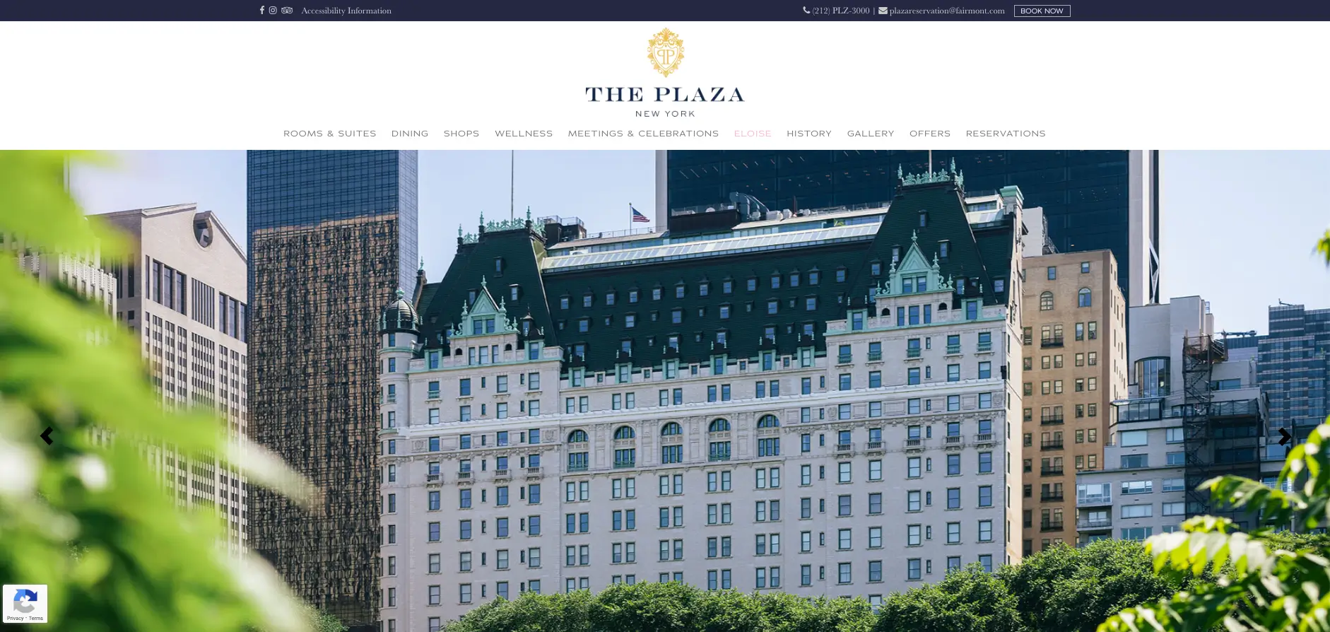 The Plaza Hotel building in New York City with a green foreground and skyline background.