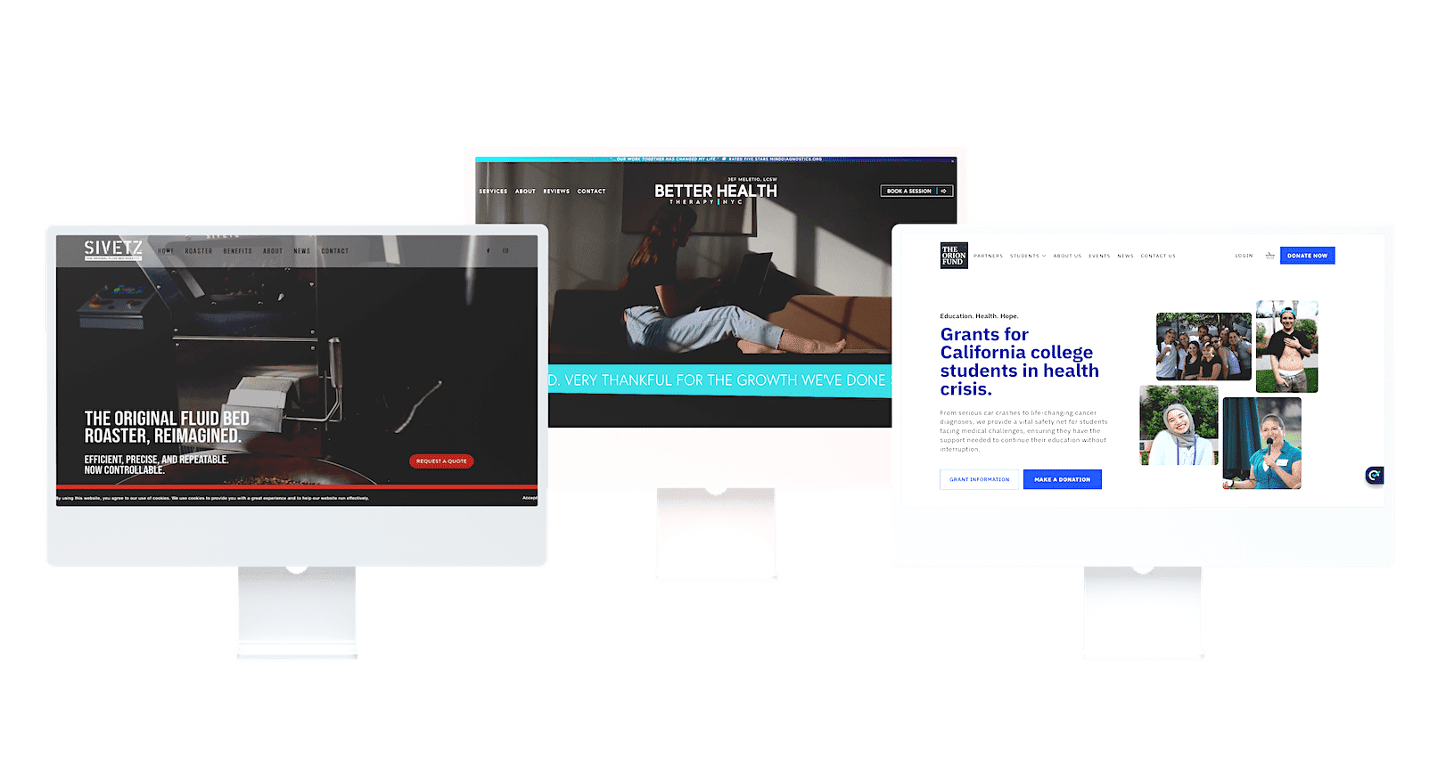 Three computer monitors showing various website designs and content on their screens.
